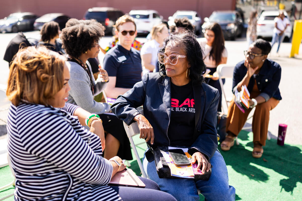 A photograph from the Thriving Together mural event.