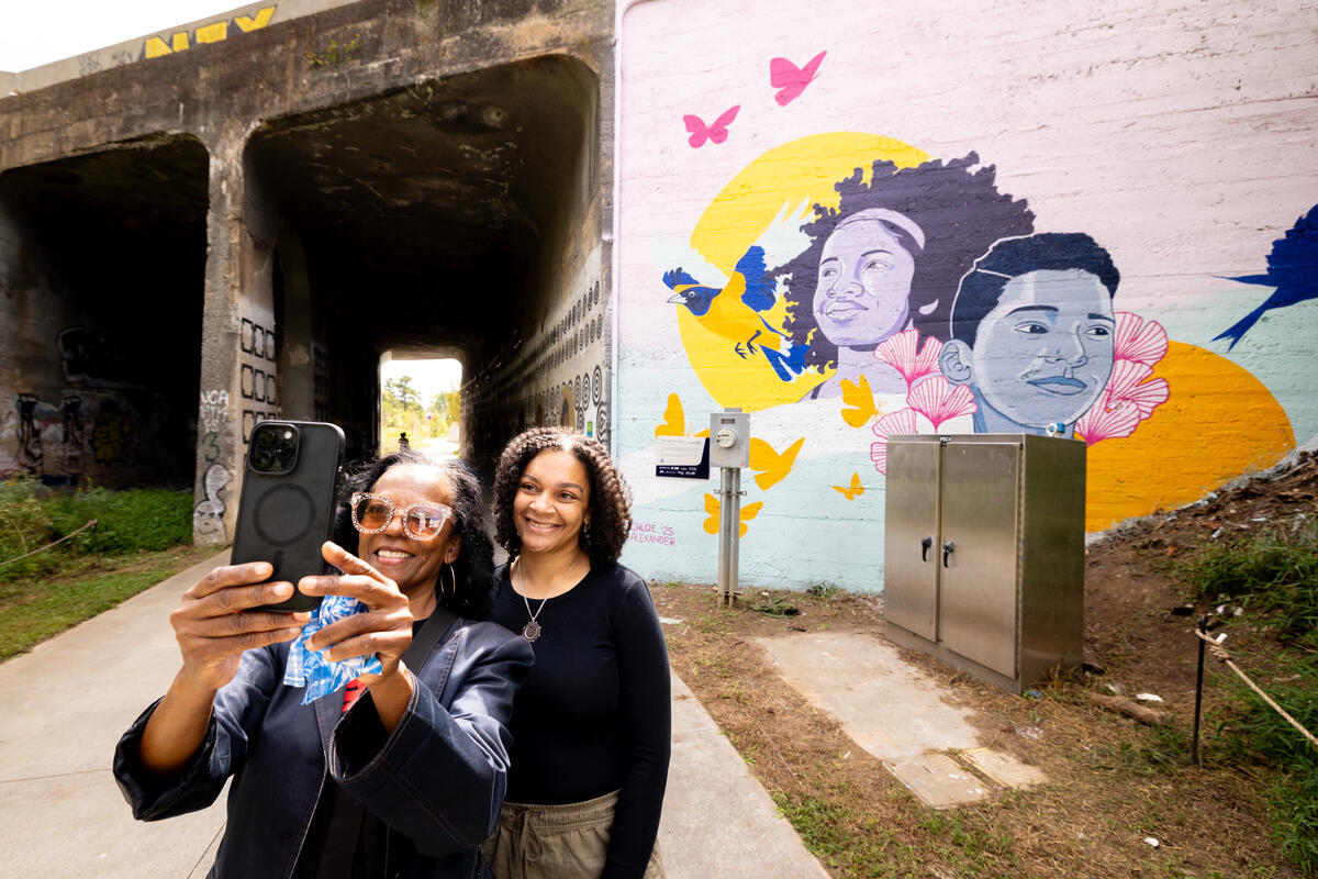 Celebratory moment at the mural unveiling in Atlanta.