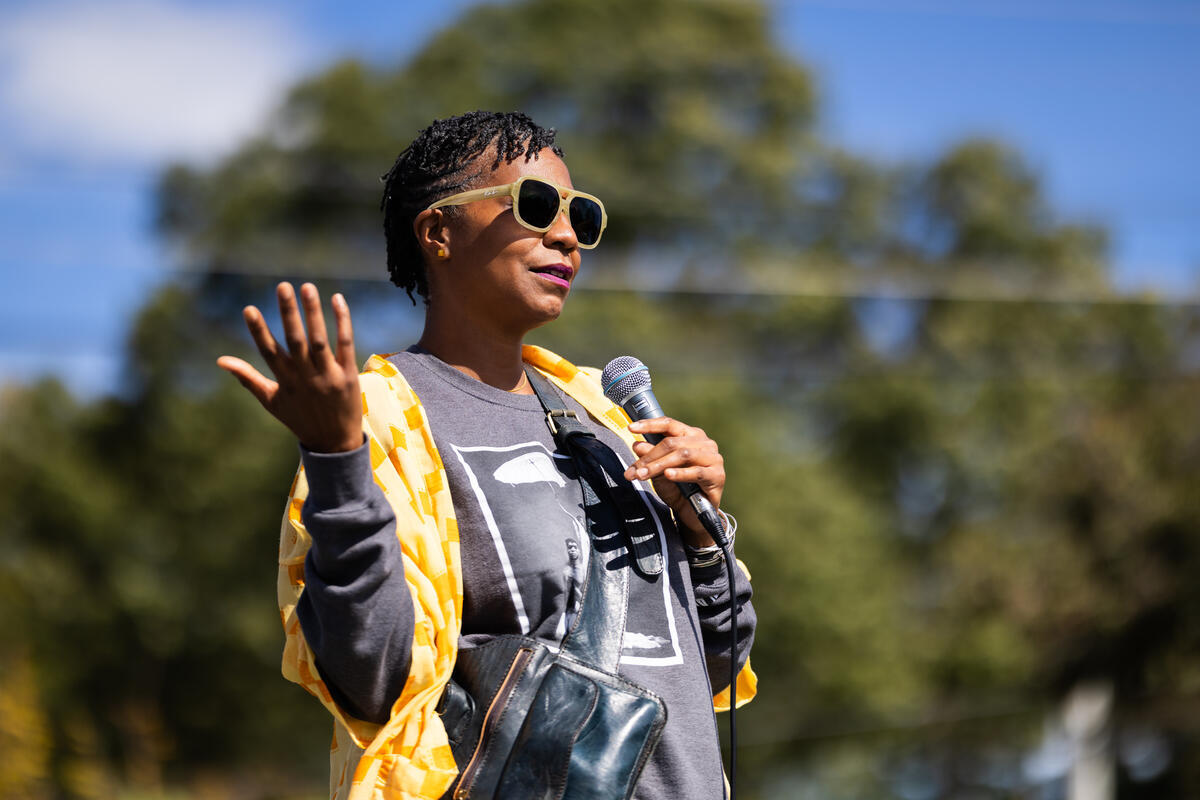 Candid portrait of an attendee at the Second Mural Unveiling.