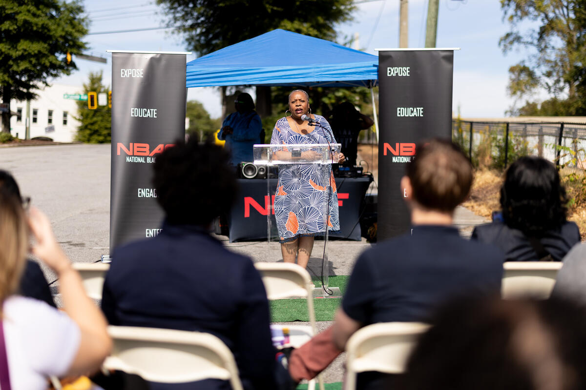 A photo capturing the mural unveiling event in Atlanta.