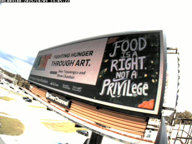 Gina Shree's art displayed on an elevated billboard