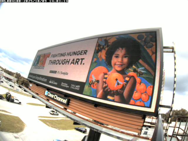 PJ Svejda's art displayed on a highway billboard
