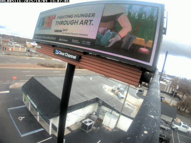 Large roadside billboard featuring artwork by Skip